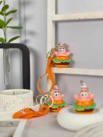 قاب گوشی آیفون 13 پرو طرح M&M با آویز