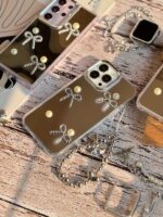 قاب گوشی آیفون 11 پرو آینه ای طرح پاپیون مرواریدی با آویز