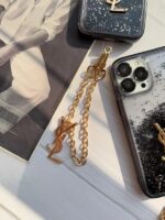 قاب گوشی آیفون 14 پرومکس طرح YSL مشکی آکواریومی با آویز